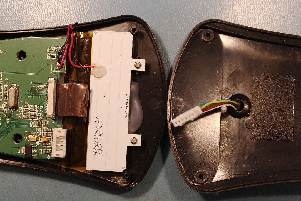 Telescope cable enters the center, applying pressure to the flex-print.