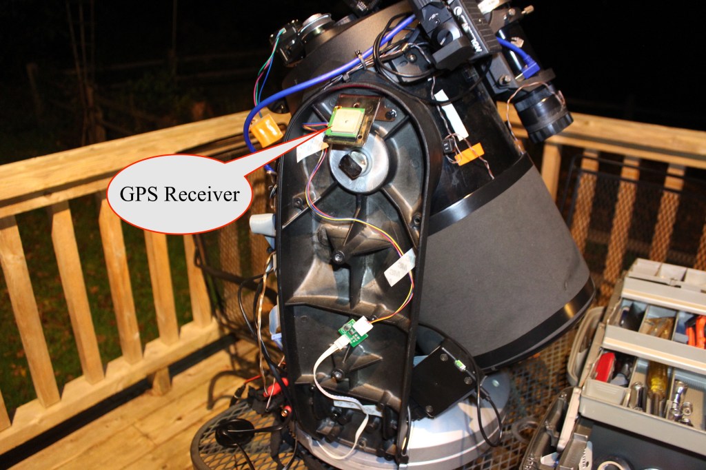 The telescope fork arm cover is removed, and one can see the innards, including the GPS receiver.